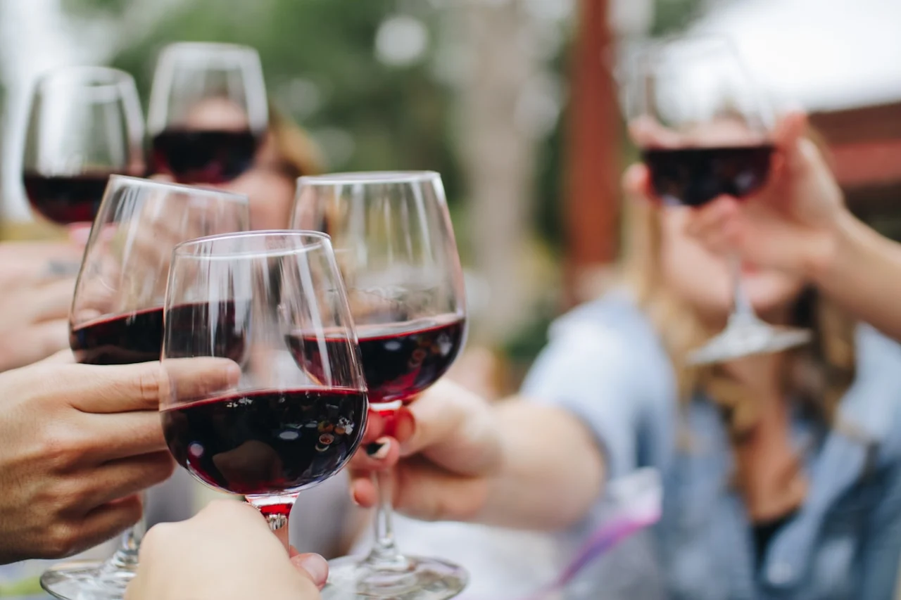 A glass of red wine for tasting before deciding whether to decant